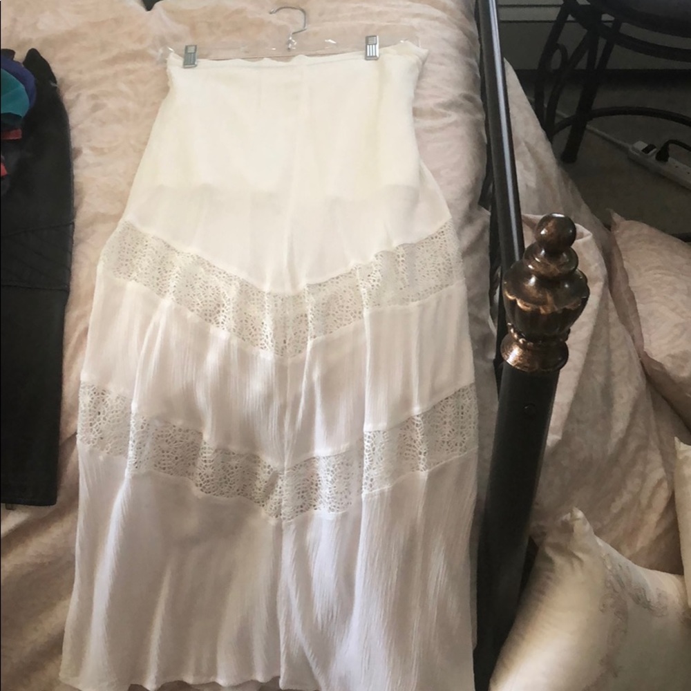 White maxi skirt with woven detailing at bottom